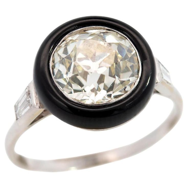 Art Deco Platinum Halo Onyx and Diamond Ring | From a unique collection of vintage Engagement Rings at https://www.1stdibs.com/jewelry/rings/engagement-rings/. 1940s Engagement Ring, Old Mine Cut Diamond, Baguette Diamonds, Onyx Stone, Deep Black, Baguette Diamond, Jewelry Rings Engagement, Vintage Engagement Rings, Bezel Setting