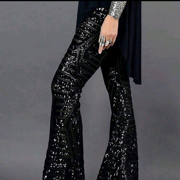 Black Hi-Waist Sequin Flare Leg Trousers Knitted Fabric 95% Polyester 5% Elastane Chic Black Bottoms For Party, Black Sequined Bottoms For Party, Elegant High-waist Sequined Bottoms, Elegant High Waist Sequin Bottoms, Chic Black Party Bottoms, Glamorous Evening Winter Bottoms, Elegant Straight Leg Bottoms With Sequins, Elegant Straight Leg Sequin Bottoms, Elegant High-waisted Sequin Pants