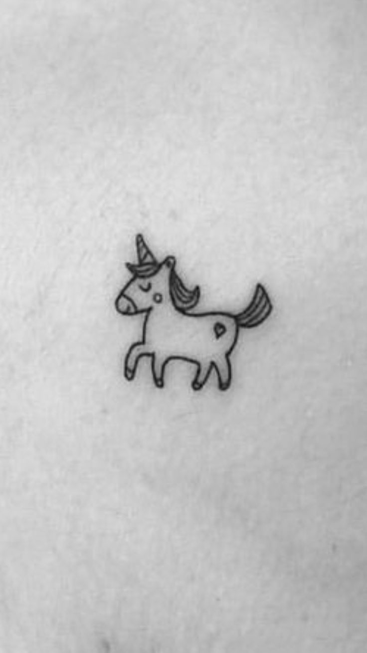 a small unicorn tattoo on the chest