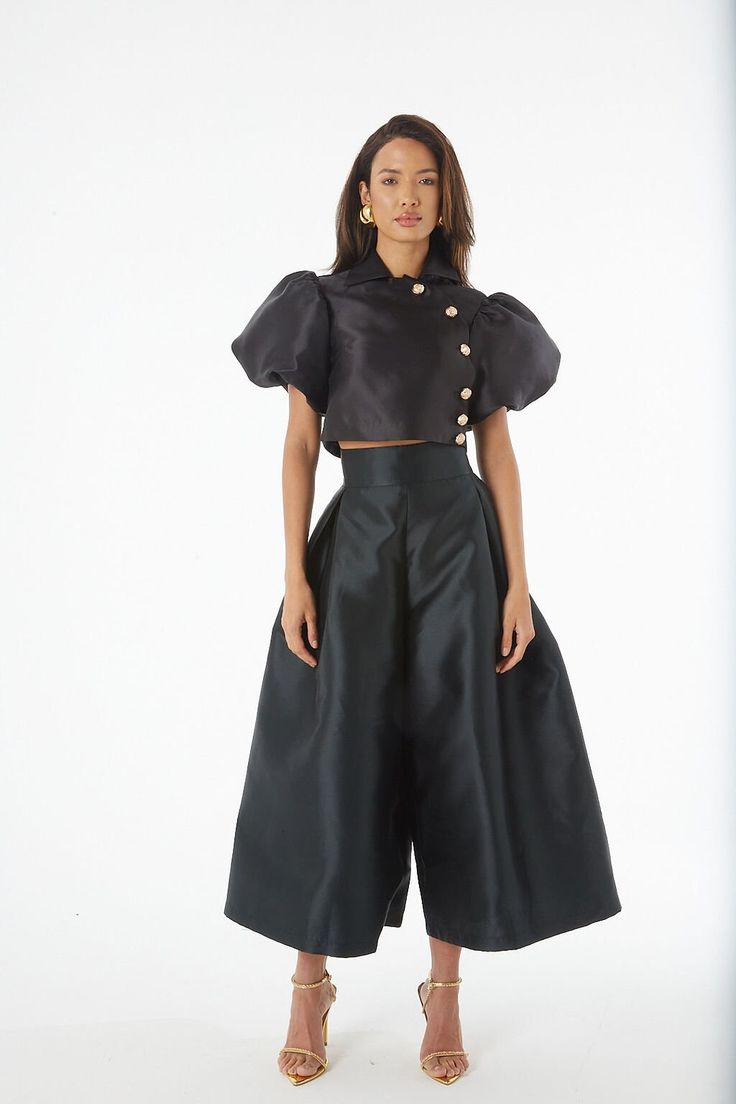 An artful mix between Culottes and a skirt, these Culottes are a dramatic statement piece, mixing a sharp, high waist and wide leg, with an elegant and unusual pleated detail at the front - the look of a skirt in a trouser. Fit - Fits true to size. Take your normal size. Silk Evening Pants For Spring, Spring Evening Silk Pants, Glamorous Skirt For Spring Costume Party, Silk Party Trousers, Glamorous Spring Skirt For Costume Party, Satin Trousers For Party, Silk Bottoms For Summer Party, Summer Silk Bottoms For Party, Satin Party Trousers