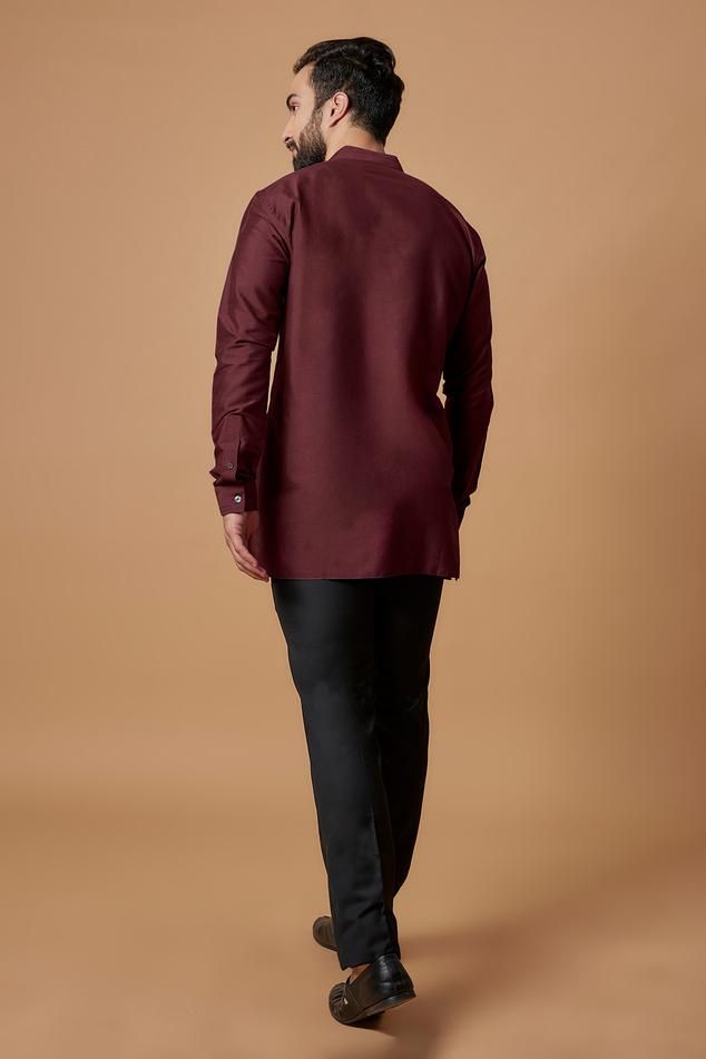 Maroon cotton silk full sleeve shirt kurta with pintuck detailing on neckline.
Components: 1
Type Of Work: Plain
Neckline: Mandarin collar
Sleeve Type: Full sleeves
Fabric: Cotton Silk
Color: Maroon
Other Details: 
Front button detailing
Cuff sleeve hem
Model height: 5ft 10inches, wearing size M
Note: Pant worn by the model is not for sale
Occasion: Mehendi and Puja - Aza Fashions Festive Semi-formal Long Sleeve Shirt, Long Sleeve Cotton Bandhgala For Eid, Cotton Nehru Jacket With Long Sleeves For Eid, Long Sleeve Cotton Nehru Jacket For Eid, Semi-formal Long Sleeve Kurta For Eid, Festive Long Sleeve Nehru Jacket For Work, Formal Cotton Nehru Jacket With Long Sleeves, Cotton Kurta For Work With Long Sleeves, Formal Long Sleeve Cotton Nehru Jacket