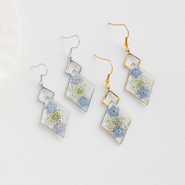 Forget Me Not Flower Earrings for Women | Handmade Real Flower Earrings | Dangle Drop Earrings | Birthday Gift for Her | Christmas Gift 🌿These Forget Me Not Flower Earrings are a stunning work of art that combines the beauty of nature with elegant craftsmanship. Handmade with real Forget Me Not flowers delicately preserved in a crystal-clear resin, these earrings are a unique and personalized gift for any flower lover.  🌿The vibrant blue color of the Forget Me Not flowers is beautifully captur Mother's Day Dangle Earrings With Flower Charm, Dangle Flower Earrings As Gift, Dangle Flower Earrings With Ear Wire As A Gift, Silver Flower Crystal Earrings For Gift, Dangle Flower Earrings With Ear Wire For Mother's Day, Silver Flower Shaped Crystal Earrings For Gift, Hypoallergenic Flower Dangle Earrings For Anniversary, Hypoallergenic Dangle Flower Earrings For Anniversary, Birthday Drop Earrings