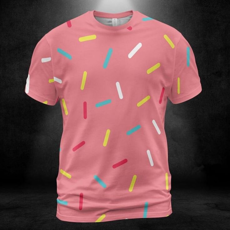 Pink Donut Sprinkles Unisex Comfort T-Shirt. Add some cuteness and fun to your t-shirt collection with this colorful Pink Donut Sprinkles Unisex Comfort T-Shirt design. Features a pink color background with multicolored sprinkles all over the shirt. It looks great on this tee shirt! This design is sure to grab attention. Product Details Step out with an instant classic! Dressed up or down, our unisex t-shirt offers complete comfort and style. Handmade with premium wear-resistant fabric, show off your style with this carefully crafted tee. -95% Polyester And 5% Spandex -4 Way Stretch -Light Fabric -Soft, breathable fabric -Crewneck -Double-needle topstitch detailing -Printed, cut, and handmade   Size & Fit   -Unisex sizing for men and women -Moderate stretch -Sizes: S-5XL Playful Short Sleeve T-shirt With All Over Print, Playful Pink T-shirt With Graphic Print, Playful Pink Graphic Print T-shirt, Cute Pink T-shirt With Graphic Print, Cute Pink T-shirt With Funny Print, Trendy Pink Top With Sublimation Print, Playful Colorful Crew Neck T-shirt, Playful Pink Short Sleeve T-shirt, Pink Short Sleeve Sweet Top