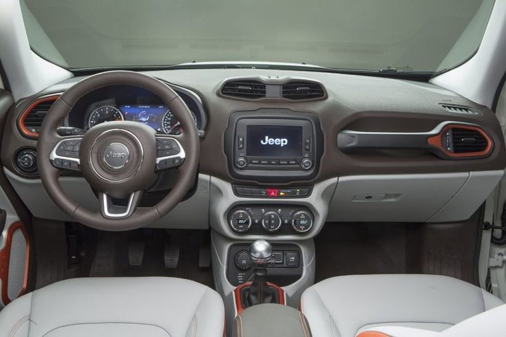 the dashboard and steering wheel of a jeep