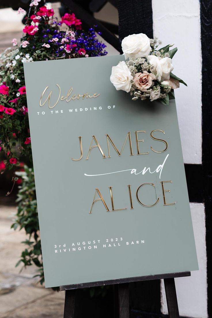 a sign that has flowers on it and the words james and alice written on it