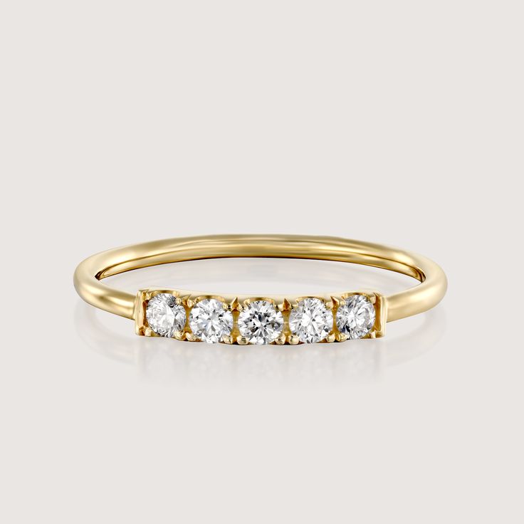 Our popular Candy Ring is gorgeous in a vintage style and set with white diamonds. The ring is 14k gold and has an stunning row of diamonds decorating the top face of the ring. It is delicate and dazzling while showing off some serious sparkle. This ring can be customized with any stones of your liking. Check out our size chart to find the perfect size for you! All features can be customized! Please contact us if you wish to make changes, we love making custom designs. All of our jewelry is carefully handmade in our atelier. *HC diamond are all conflict-free diamonds To order by phone 972-72-2991000 Formal Eternity Band With Rose Cut Diamonds, Classic Yellow Gold Half Eternity Diamond Ring, Formal Yellow Gold Half Eternity Diamond Ring, Formal Rose Cut Diamond Eternity Band, Timeless Yellow Gold Diamond Ring With Accents, Classic Cubic Zirconia Rings With Half Eternity Detail, Classic Cubic Zirconia Half Eternity Ring, 14k Gold Half Eternity Diamond Promise Ring, Classic Eternity Band With Rose Cut Diamonds For Promise