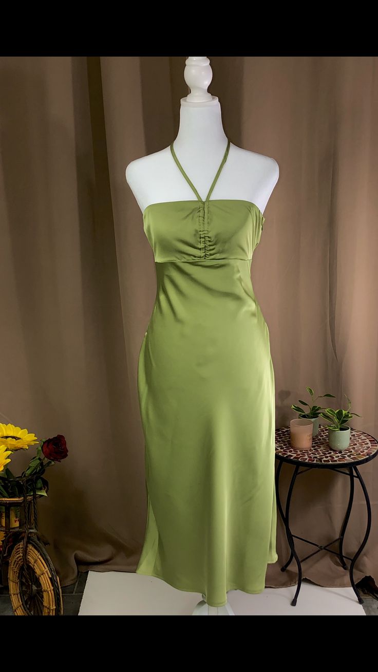 Midi dress Halter neck tie fastening Zipper fastening on the side 97% polyester 3% spandex Model is wearing a size small Color- green Green Maxi Dress For Date Night, Light Green Fitted Dress For Brunch, Green Summer Dress For Date Night, Chic Light Green Mini Dress For Party, Elegant Fitted Light Green Dress, Elegant Light Green Fitted Mini Dress, Casual Green Maxi Dress For Date Night, Elegant Fitted Light Green Mini Dress, Spring Green Maxi Dress For Date Night