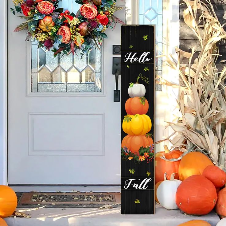 a door with pumpkins and flowers on it