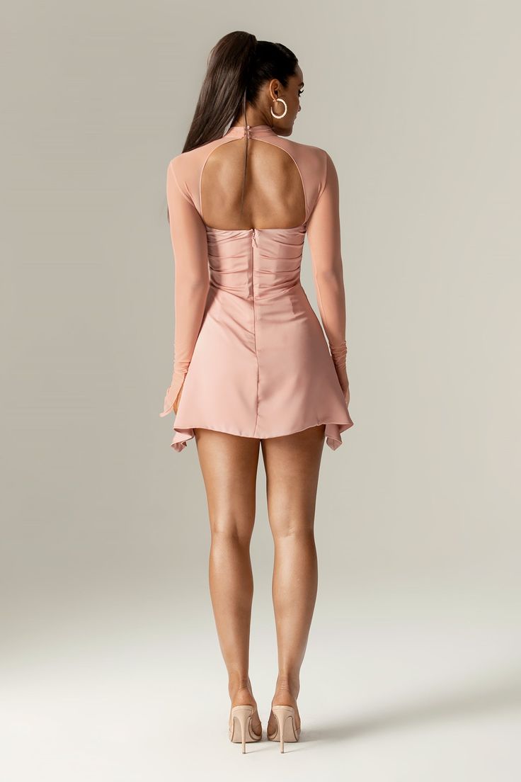 Our 'Maya' mini dress is so fun and flirtatious, making it perfect for romantic date nights. Made from our soft silk satin in a dusty pink hue, 'Maya' is cut on the bias and has so many pretty details. The cross-front halter shape is so flattering and creates a skin-baring open front with a beautifully draped cowl neckline, fitted with our incredible corsetry boning to really cinch the waist. The dramatic sleeves have flared cuffs, and 'Maya' is fully lined for comfort, with a zip and button fas Draped Corset, Dramatic Sleeves, Corset Mini Dress, Romantic Date, Dress Dusty, Cowl Neckline, Romantic Dates, Dusty Pink, Silk Satin