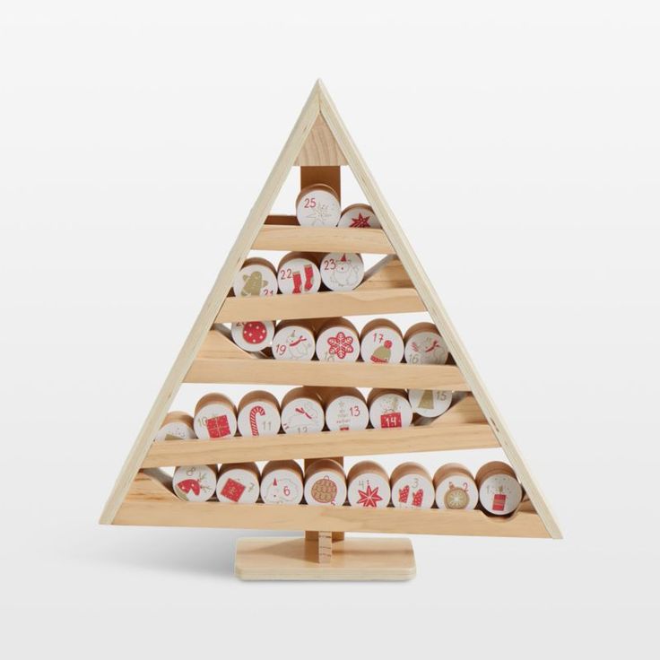 a wooden christmas tree with lots of different items on the bottom and one in the middle