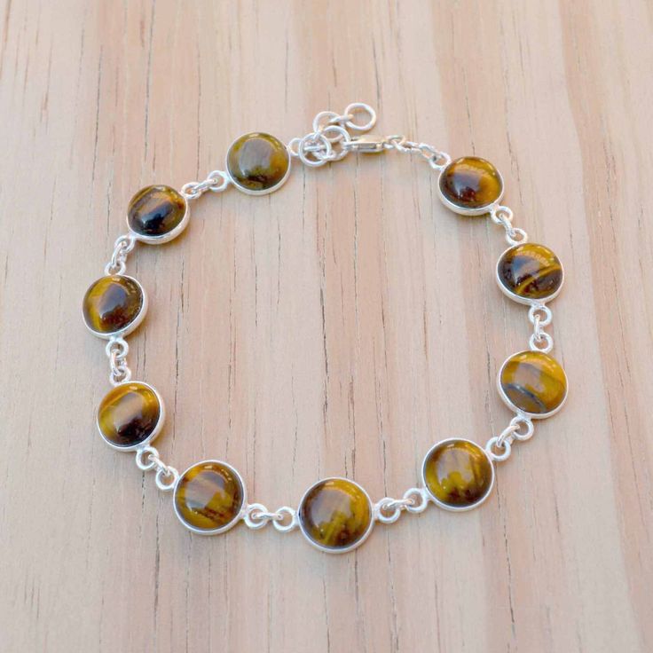 Round Tiger Eye Crystal And 925 Sterling Silver Handmade Bracelet, Natural Gemstone And Solid Silver Jewelry, Hypoallergenic And Tarnish Free, Lightweight And Comfortable Metal : 925 Sterling silver  Gemstone : Tiger Eye Ideal For: Men, Women, boys, Girls  World Wide Free Shipping. Shipping Services -USPS, UPS, DPD, and ECOM. Order Below 150 USD Will Ship Through USPS. (8 To 25 Working Days Delivery) It depends on your country customs clearance. Processing Time-  Your order will be handmade and Sterling Silver Bracelets With Round Natural Stone Beads, Sterling Silver Bracelets With Natural Stone Round Beads, Sterling Silver Beaded Bracelets With Natural Stones, Handmade Sterling Silver Beaded Bracelets, Sterling Silver Crystal Bracelet For Jewelry Making, Sterling Silver Gemstone Beads Bracelet For Jewelry Making, Silver Bracelets With Natural Stones And Round Beads, Sterling Silver Gemstone Beaded Bracelets For Jewelry Making, Silver Gemstone Bracelets With Round Beads