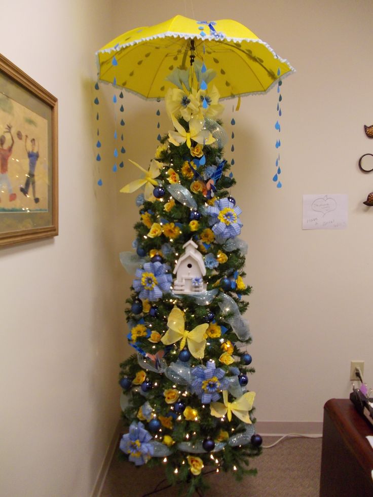 a decorated christmas tree with an umbrella