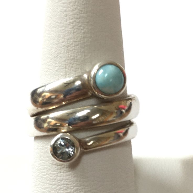 This Sterling Silver Wrap Style Ring Has A Band Of Sterling Silver Wrapped Around 3 Times With Larimar On One Tip And Faceted Blue Topaz On The Other. As With All My Listings, This Is New Never Worn. Thank You For Your Interest. Sterling Silver Turquoise Ring With Gemstone Accents, Blue Turquoise Ring With Gemstone Accents In Sterling Silver, Turquoise Topaz Ring With Accent Stones In Sterling Silver, Turquoise Blue Topaz Gemstone Rings, Modern Blue Gemstones With Accents, Sterling Silver Turquoise Topaz Ring, Elegant Silver Stackable Rings With Natural Stones, Turquoise Blue Topaz Ring With Gemstone Accents, Elegant Blue Larimar Turquoise Ring