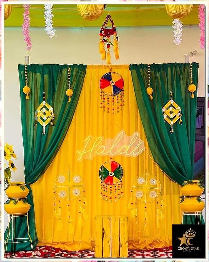 If you're looking for creative and affordable wedding decorations, check out our collection! We've got all the supplies you need to create beautiful decorations on a budget. Backdrop For Haldi Function, Haldi Wallpaper Background, Simple Haldi Backdrop At Home, Mehandi Theme Decor, Mehandi Function Decoration At Home, Haldi Function Decoration At Home Simple, Haldi Decoration Ideas Simple, Haldi Backdrop At Home, Haldi Function Ideas