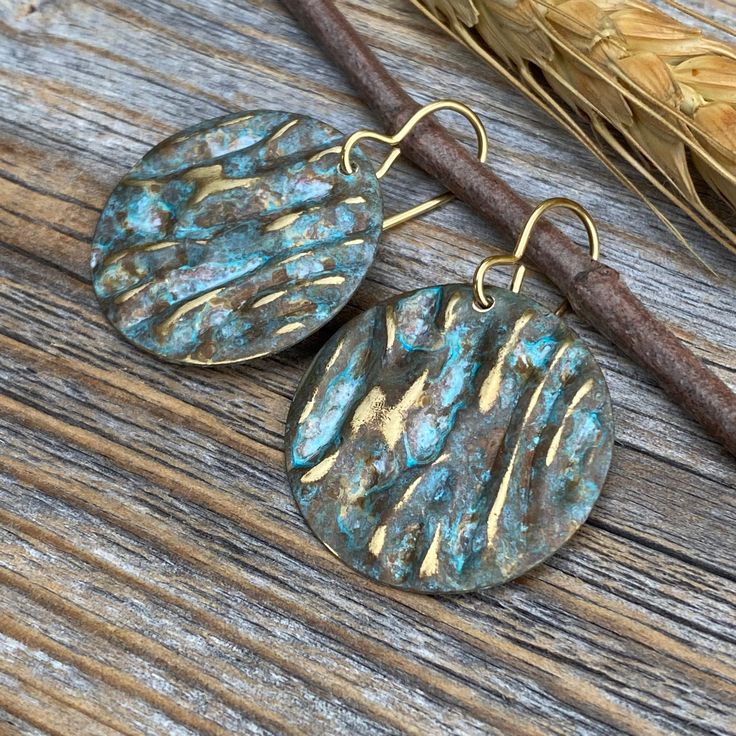 Unique Boho Inspired Vintage Patina dangle earrings-made with Natural Brass. Includes 10K Gold Plated Ear Wire and Silicone Earring Backs: These earrings are perfect if you are looking for that southwestern boho look. Throw them on with any outfit and they will definitely add some character. Perfect with a white T and a pair of jeans! These earrings are medium size, but very light weight and a perfect everyday wear. They are approximately 1.5 inches in length and 1 inch at the widest portion. To Bohemian Gold Earrings With Patina, Gold Bohemian Earrings With Patina, Artisan Earrings With Patina For Gifts, Artisan Earrings With Patina As Gift, Artisan Patina Earrings As A Gift, Handmade Bronze Drop Earrings, Gold Round Soldered Earrings, Gold Round Earrings With Soldered Details, Rustic Handmade Teardrop Earrings