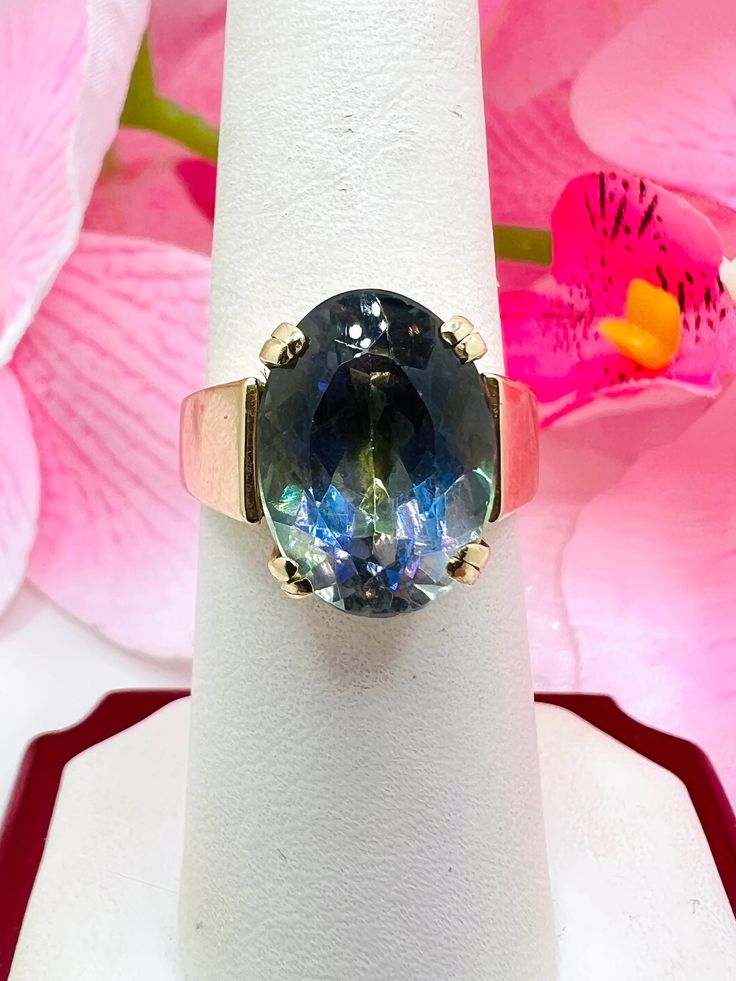 14K Yellow Gold Synthetic Alexandrite Cocktail Ring Size 7 A perfect gift for your loved one for any special occasion or holiday! Total Ring Weight: 11.50g Ring Length: 27.29mm Ring Width: 20.19mm Gemstone: Synthetic Alexandrite Item will be placed into a gift box. * High Luster Oval Ring In 14k Gold, High Luster 14k Gold Oval Rings, Iridescent Oval Rings For Gifts, Elegant Iridescent Rings With Accent Stones, 14k Gold High Luster Rings As A Gift, 14k Gold Rings With High Luster For Gift, Fine Jewelry Rings As Gift With High Luster, High Luster 14k Gold Rings For Gift, Iridescent Fine Jewelry Ring For Anniversary