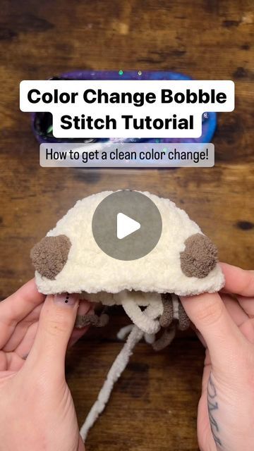 someone is holding a stuffed animal in their hands with the text, color change bubble stitch tutor