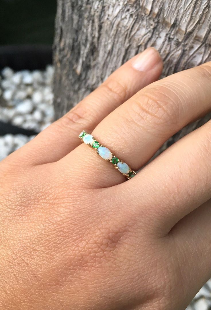 Opal and Emerald Half Eternity Matching Band Ring. Material: Solid Gold or PLATINUM Finishing: High Polished, Shiny Fit: Standard Width: 3.2 mm Height: 3 mm Setting: Prong Stone #1: Natural Opal Shape: Oval Size: 3mm x 5mm Quantity: 5 Opals Stone #2: Natural Emerald Quality: AAA Cut: Round, Diamond Cut Size: 2mm Quantity: 4 Emeralds This band will turn your Engagement Solitaire into a Sophisticated Wedding Set (Bridal Set). It will make your Solitaire Ring to pop out and look more eye catchy and Oval Green Multi-stone Diamond Ring, Green Oval Multi-stone Diamond Ring, Green Multi-stone Oval Diamond Ring, Oval Yellow Gold Emerald Ring With Multi-stone, Oval Yellow Gold Emerald Ring With Multiple Stones, Oval Multi-stone Emerald Ring In White Gold, Gold Oval Multi-stone Stackable Rings, Oval Half Eternity Band For Formal Occasions, Elegant Oval Bands For Anniversary