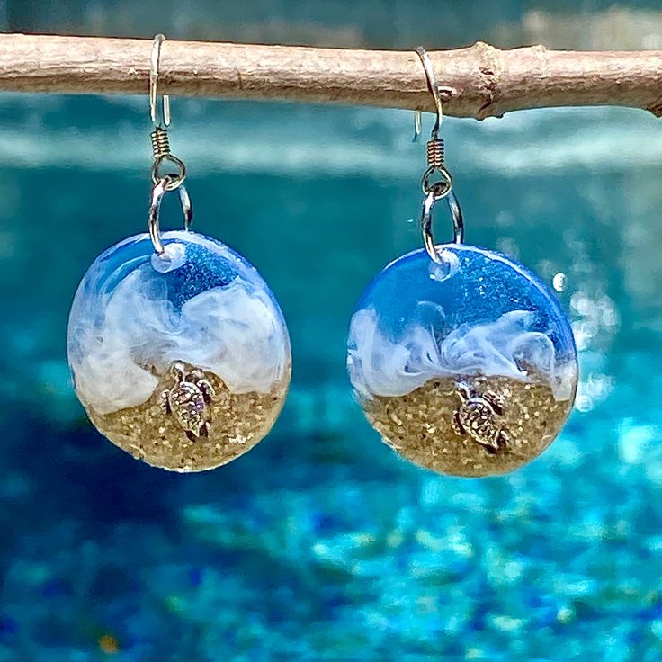 "These realistic beach earrings are made with layers of resin, bright colorful inks and real sand with a 3D silver turtle crawling in the sand. These earrings are 1\" diameter. I make my own molds and each set is handmade so you won't find these anywhere else. These are made to order and yours may be slightly different than those pictured." White Resin Earrings For The Beach, Resin Drop Earrings For Beach, Resin Dangle Earrings For Beach, Unique Round Earrings For Beach, Handmade Sand-colored Ocean-inspired Jewelry, Handmade Ocean-inspired Sand Colored Jewelry, Tropical Jewelry, Beach Earrings, Turtle Beach