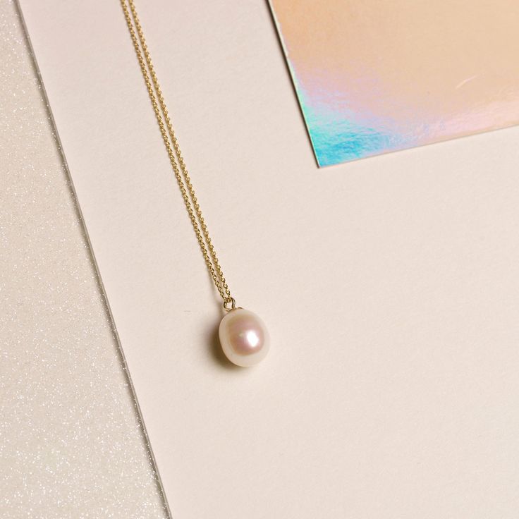 We’re picky about our pearls. Our collection of modern-feel pearl pieces takes your grandmother's favorites and incorporates them into the latest trends, interpreted from our NYC-gal perspective. These gem-quality pearls are freshwater cultured beauties, set in solid gold that won't tarnish or flake. We may have expensive taste, but crazy mark-ups aren’t really our thing. So we balance the best quality and the best price — enough said. 14k Solid yellow gold 9mm x 7mm Oval-shaped freshwater cultu Classic Everyday Pearl Drop Jewelry, Elegant Teardrop Everyday Jewelry, Classic Sterling Silver Necklace For Everyday Elegance, Everyday Elegance Yellow Gold Jewelry With Pearl Charm, Elegant Pearl Necklace For Everyday Wear, Elegant Pearl Necklace For Everyday Elegance, Fine Jewelry Briolette Pearl Charm, Everyday Teardrop Pearl Necklace, Elegant Everyday Jewelry With Pearl Drop