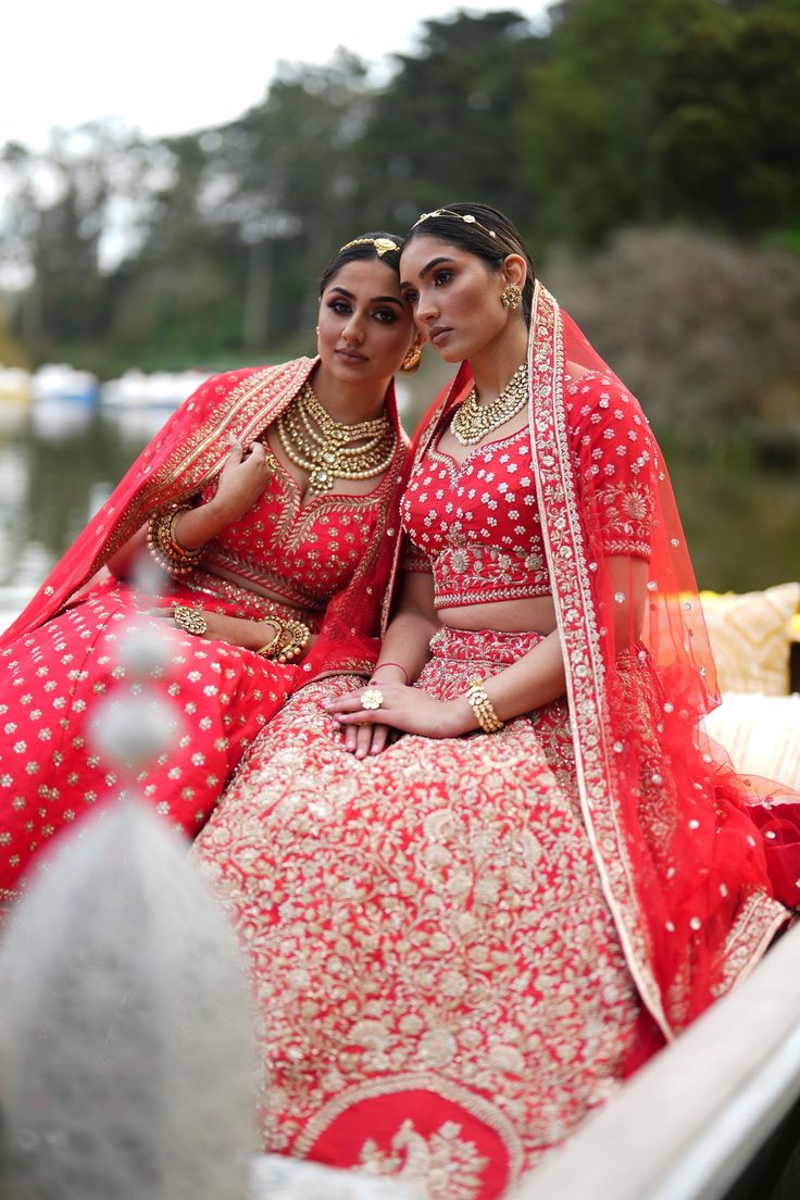 Nyquil - Blood Red Silk Modern Indian Bridal Lehenga with Dabka & Sequins Steal the spotlight this bridal season in this stunning red bridal lengha set with intricate Dabka embroidery! Sweetheart dupion silk fabric choli blouse w/ Dabka Sophisticated sweetheart neck Breathable dupion silk blouse Beaded Dori closure at back bodice Elbow-length sleeve with handwork Opulent Dabka embroidery all over Bidded hemline for a neat finishing Weightless dupion silk lengha w/ Dabka & Sequins Flared red brid Wedding Anarkali Gown With Meenakari, Red Dola Silk Gown For Festivals, Red Gown With Pallu For Traditional Ceremonies, Red Embroidered Dola Silk Gown, Embroidered Red Dola Silk Gown, Traditional Meenakari Wedding Gown, Red Dola Silk Gown With Intricate Embroidery, Red Dola Silk Anarkali Set For Wedding, Red Art Silk Anarkali Set For Wedding