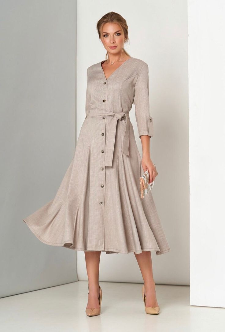 A classic elegant dress with a fitted silhouette, V-neck and 3/4 sleeves. Includes a belt. Material: costume linen Made in Europe Chic Linen Dress With 3/4 Sleeve, Formal V-neck Linen Dress, Elegant Belted Midi Dress With 3/4 Sleeves, Elegant Belted Midi Dress With Button Closure, Fitted V-neck Linen Dress With Buttons, Elegant Linen Dress With 3/4 Sleeves, Half Sleeve Dresses With Button Closure, Elegant Beige Linen Workwear Dress, Elegant Belted Linen Dress For Work