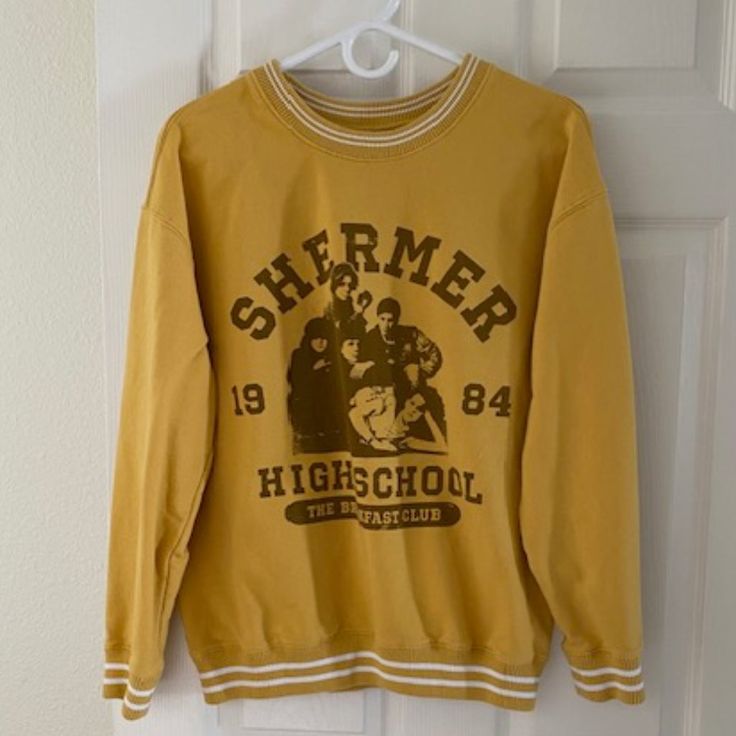 The Breakfast Club Varsity Sweatshirt New Without Tag Size L Never Worn Excellent Condition Measurements (Laid Flat) Bust (Pit To Pit) 22“ Length 24.5" Sleeves 19" Oversized Yellow Crew Neck Sweatshirt, Yellow Tops For Fall Streetwear, Oversized Yellow Sweatshirt With Letter Print, Trendy Yellow Sweatshirt With Letter Print, Yellow Letter Print Sweatshirt For Fall, Trendy Yellow Crew Neck Sweatshirt, Yellow Long Sleeve Sweatshirt With Graphic Print, Yellow Graphic Print Long Sleeve Sweatshirt, Retro Long Sleeve Yellow Tops