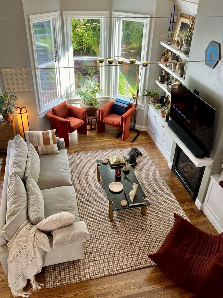 a living room filled with furniture and a fire place