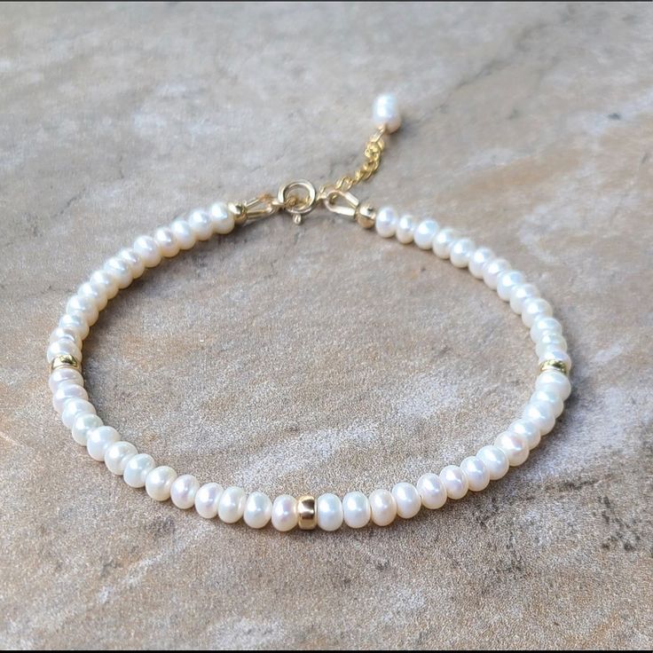 Freshwater Pearl Bracelet Item Description ********************** Handmade In Usa Freshwater Pearls, 4mm 14k Gold Filled Rondelle, 4mm 14k Gold Filled Spring Ring Clasp, 5.5mm 14k Gold Filled Extended Chain, 1 Inch Pearls Are 100% Genuine Made To Order In Sterling Silver Length 6.5”+1” Inch Extender Chain ( Custom Length Is Available ) Classic White 14k Gold Filled Jewelry, White 14k Gold Filled Jewelry For Anniversary, Delicate White Beaded Round Bracelets, Dainty White Bracelets For Anniversary, Delicate White Bracelet For Anniversary, Dainty White Bracelet For Anniversary, White Minimalist Bracelets For Anniversary, Minimalist White Bracelets For Anniversary, White Single Strand Bracelet Gift