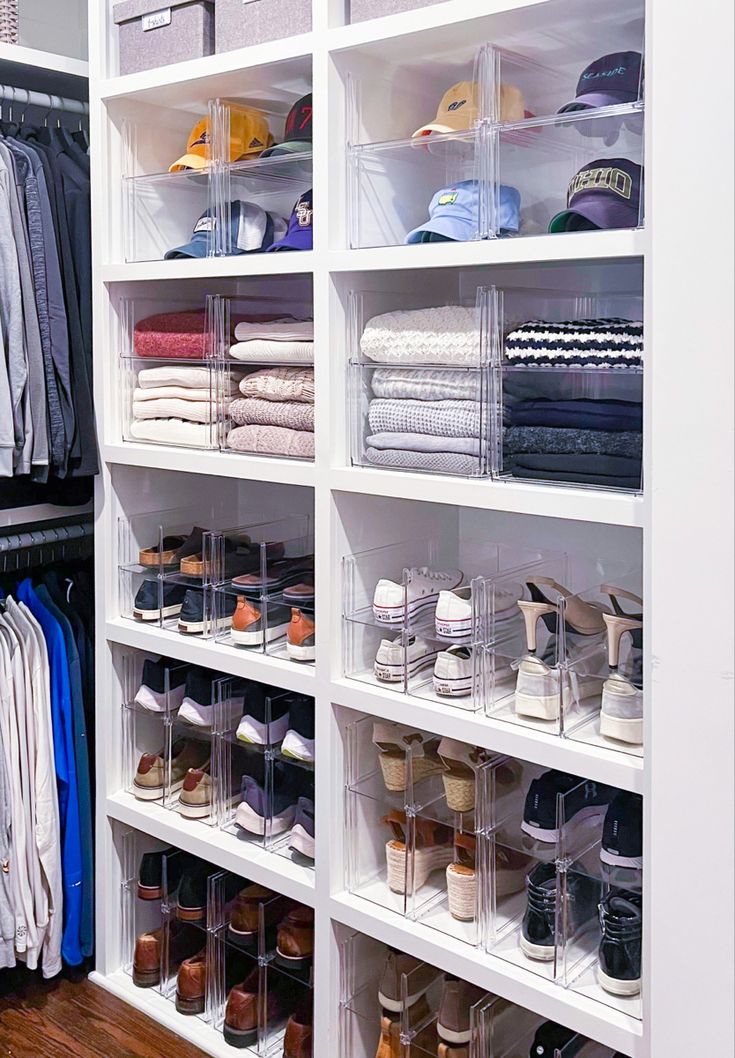 an organized closet with clear bins and shelves