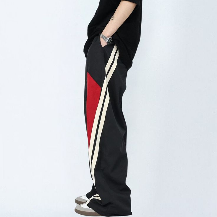 Get ready to hit the streets in style with our Street Stitching Quick-Drying Sweatpants. Perfect for the urban adventurer, these sweatpants are designed with quick-drying fabric to keep you cool and comfortable on the move. Stand out from the crowd with our unique street stitching detail. Features: -85% Polyester -Adjustable Waistband -Solid Color -MId-rise waist -Regular fit Streetwear Straight Leg Pants With Contrast Color, Straight Leg Pants With Contrast Color For Streetwear, Streetwear Cotton Pants With Contrast Color, Black Stretch Pants For Streetwear, Contrast Color Cotton Pants For Streetwear, Black Relaxed Fit Hip Hop Parachute Pants, Streetwear Cotton Bottoms With Contrast Color, Black Hip Hop Parachute Pants With Relaxed Fit, Casual Cotton Pants With Contrast Color