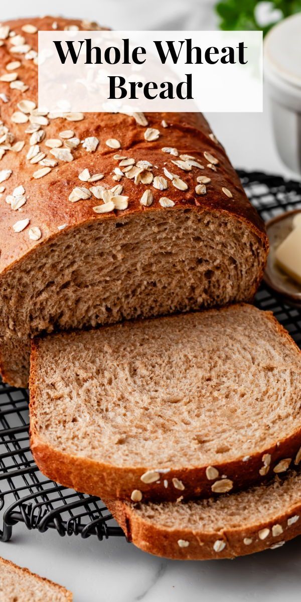 whole wheat bread sliced and sitting on a cooling rack