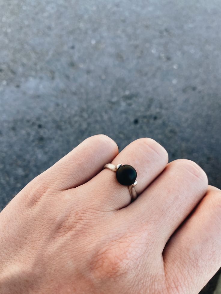 Minimalism, geometry, form, contrast, and movement all come together in this ring. The spinning shungite sphere captivates attention with its rich matte texture. Pictured is one of the kinetic rings with spinning stones from our KinneTikko collection.KinneTikko is a collection of jewelry with moving elements, inspired by kinetic art. After all, nothing is static. Everything is always in motion, even if we cannot see it. Life is movement, and movement is the essence of life. Our jewelry with movi Modern Silver Jewelry, Kinetic Art, Fidget Rings, Matte Texture, Spinner Ring, Spinner Rings, Black Matte, Stone Ring, Black Onyx