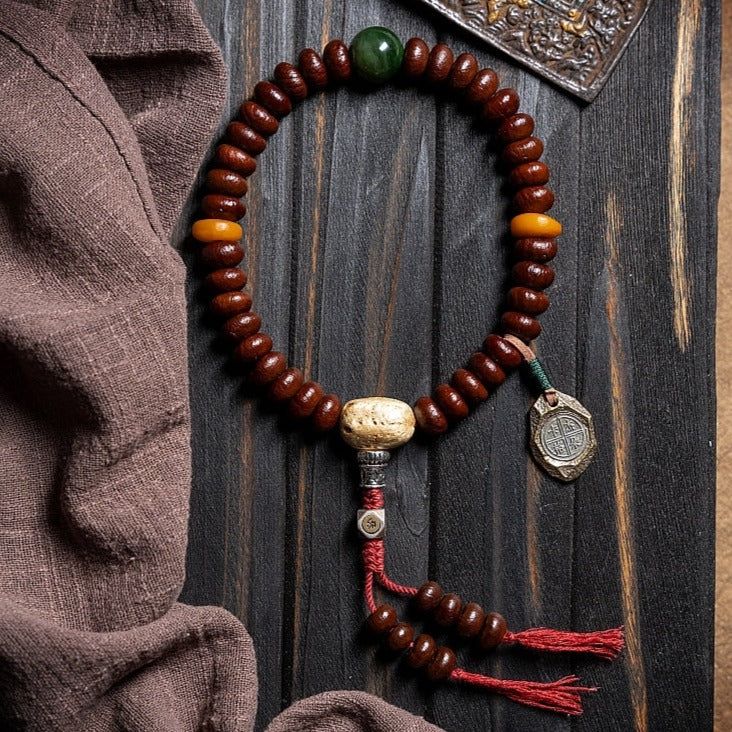 Inspired by the peaceful teachings of Tibetan Buddhism, this special Mala combines traditional palm seeds with the wisdom of the zodiac. Feel the positive vibes, balance your energies, and connect with the universe's cosmic dance. Each bead holds ancient wisdom, guiding you gently on your path to peace and enlightenment. · Beads Material: Palm Seeds (Daemonorops Margaritae seed)· Green Bead: Hetian Jasper· Other Beads: Amber Beads· Zodiac Sign: Silver· Bead Size: 12mm· Process: Handmade (Up to f Cosmic Dance, Buddhist Mala, Tibetan Buddhism, Amber Beads, Beaded Material, The Wisdom, Silver Bead, Ancient Wisdom, Mala Beads