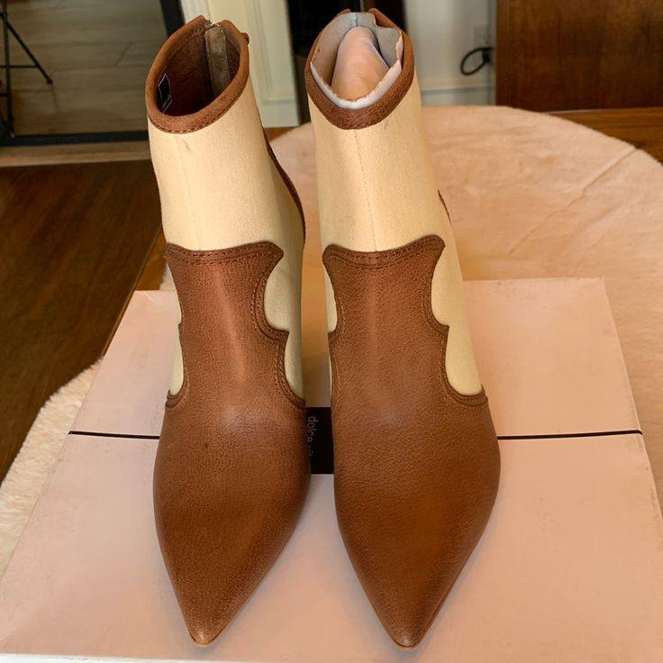 Brand New Never Worn Dolce Vita Noraya Heeled Booties Brown With Cream Canvas. Original Box Size 6.5 3.75" Heel Beige Leather Pointed Toe Heels, Summer Pointed Toe Boots With Wrapped Heel, Brown Pointed Toe Heels With Contrasting Heel Counter, Spring Beige Faux Leather Boots, Beige Pointed Toe Boots With Leather Sole, Brown Pointed Toe Heels For Spring, Brown Boots With Sculpted Heel For Spring, Cream Almond Toe Heels In Faux Leather, Beige Pointed Toe Boots For Summer