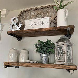 two wooden shelves with plants and other items on them