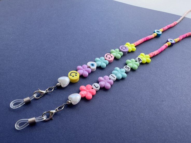 ⭐️Why did I design this eyeglass chain?⭐️  My unique design is perfect for girls who like to add a whimsical touch to their outfits. The cheerful fimo beads create a fun and colorful look, while the evil eye bead adds an extra layer of protection and positivity. ⭐️You can also ask me to write the name or slogan you want with letter beads. ⭐️Why should you have the trendy beaded eyeglass chain holder ? ✨You can have one for many different uses, such as an eyeglass holder, elegant necklace, sungla Trendy Multicolor Glasses Chains, Adjustable Personalized Plastic Jewelry, Trendy Pink Jewelry For Personal Use, Personalized Multicolor Plastic Jewelry, Trendy Multicolor Glasses Chains As Gift, Gift Plastic Glasses Chains With Adjustable Chain, Trendy Handmade Adjustable Glasses Chains, Adjustable Pink Glasses Chains As Gift, Handmade Adjustable Pink Glasses Chains