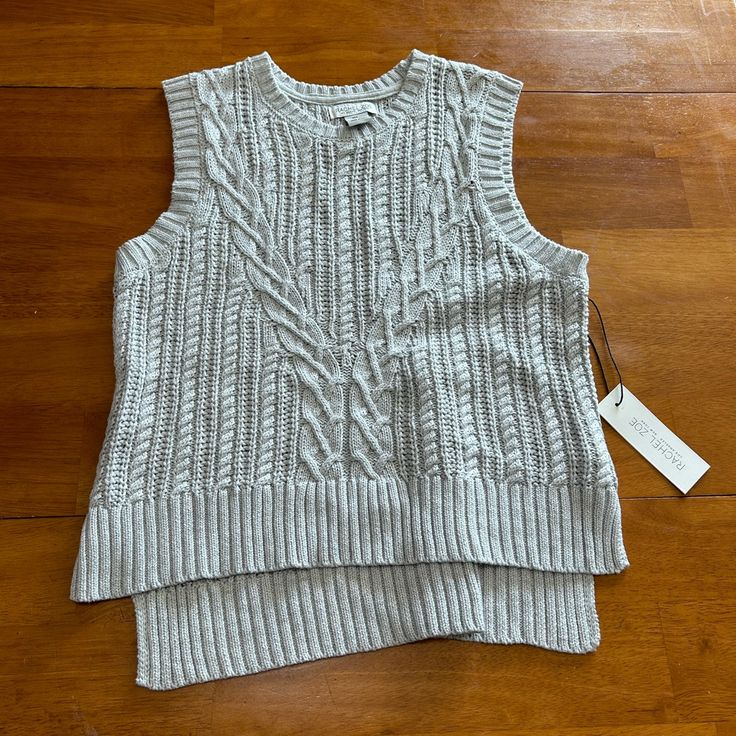 Stylish Gray Cable Knit Sleeveless Top. Perfect For Layering. Soft And Comfortable. Cozy Knit Sweater Vest For Spring, Chunky Knit Sweater Vest For Layering, Fall Knitted Sleeveless Tank Top, Cozy Knit Sleeveless Sweater Vest, Textured Knit Tank Top For Fall, Fall Textured Knit Tank Top, Textured Knit Cotton Tank Top For Layering, Fall Sleeveless Knitted Tank Top, Casual Cable Knit Sleeveless Tank Top