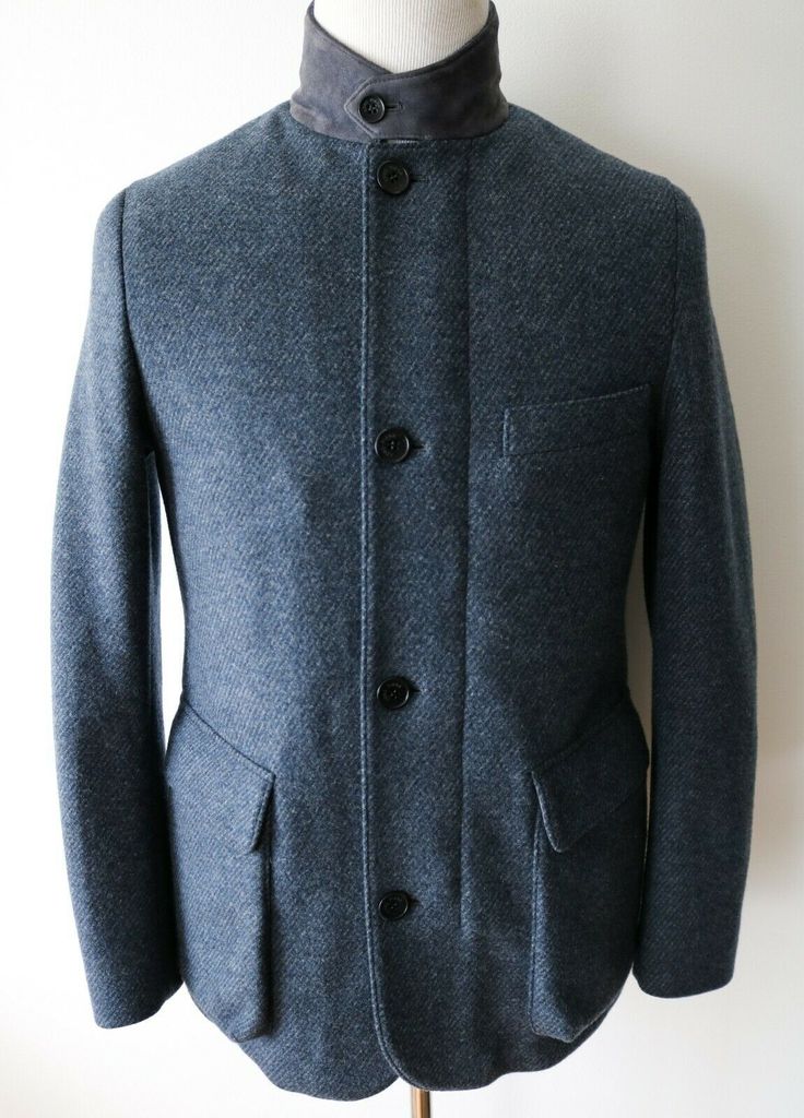 BRAND: Loro Piana SIZE: Marked as 3XL COLOR: Blue MATERIAL:  Outer: 96% Cashmere 4% Nylon  Details: 100% Goatskin (Suede) Inner: 100% Castorino (Dyed Bleached Nutria Fur) FEATURES: - stay warm in this iconic Loro Piana Roadster coat - beautiful blue color - cashmere storm system rain and wind technology - finished in soft cashmere and nylon blend material - stand suede collar with button closure - two way front zip closure with signature Loro Piana zipper pulls - also has an additional button fr Blue Wool Coat With Lapel Collar And Pockets, Luxury Outerwear With Stand Collar, Fitted Outerwear With Stand Collar, Winter Outerwear With Welt Pockets And Stand Collar, Winter Outerwear With Stand Collar And Welt Pockets, Winter Tweed Jacket With Concealed Placket, Tailored Navy Outerwear With Concealed Placket, Navy Outerwear With Notch Lapel And Concealed Placket, Blue Winter Outerwear With Hidden Button Closure