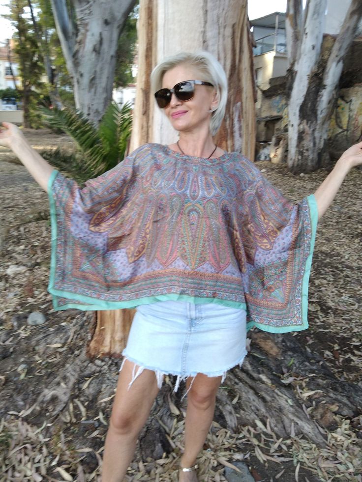 Silk poncho Fits size S/M Spring Hippie Style Free Size Kaftan, Hippie Style Free Size Spring Kaftan, Hippie Free Size Kaftan For Spring, Hippie One-size Kaftan For Spring, One Size Long Sleeve Beach Cover-up Top, Bohemian Tunic For Fall Day Out, Bohemian Tunic For Day Out In Fall, Bohemian Long Sleeve Blouse As Beach Cover-up, Bohemian Tunic For Fall Vacation