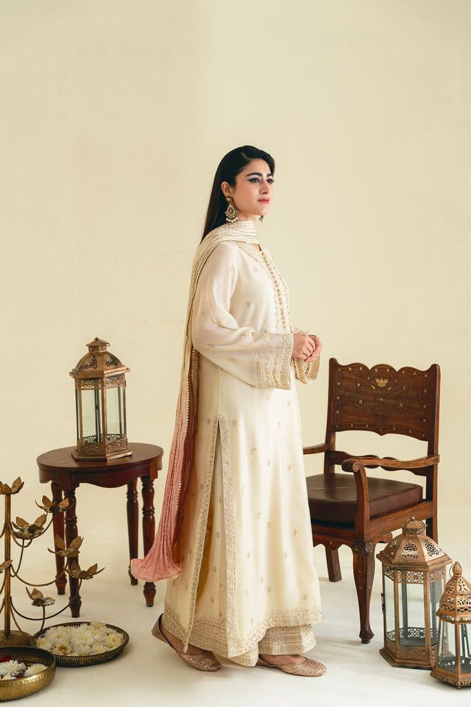 Taree Traditional Chinon Lawn Suit With Resham Embroidery, Festive Raw Silk Lawn Suit With Traditional Drape, Unstitched Raw Silk Traditional Wear For Eid, Designer Raw Silk Lawn Suit With Resham Embroidery, Designer Raw Silk Lawn Suit For Eid, Festive Lawn Suit With Dabka On Raw Silk, Festive Raw Silk Lawn Suit With Dabka, Festive Raw Silk Lawn Suit With Zari Work, Festive Designer Raw Silk Lawn Suit