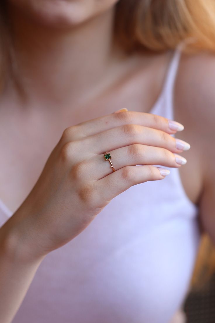 "14k & 18k Natural Emerald Ring / Genuine Emerald Ring Available in Gold, Rose Gold and White Gold / May Birthstone ❥ ITEM DETAILS ---> Gold Color of Choice : Yellow Gold, Rose Gold, White Gold ---> Material : 14k ( 585 ) or 18k ( 750 ) Real Gold. It is Not Gold Filled or Gold Plated ---> Made to order ---> Band Thickness : 1.30 mm ---> Band Width : 1.50 mm ---> Number of Stones: 4x4 MM Size 1 Princess Shape Emerald , 1 Diamond ---> Total Carat : 0.30ct Emerald and 0.01c Most Expensive Engagement Ring, Expensive Engagement Rings, Natural Emerald Rings, Evil Eye Necklace Gold, Pretty Jewelry Necklaces, Purple Amethyst Ring, Gold Rings Fashion, Gold Ring Designs, Simple Engagement Rings