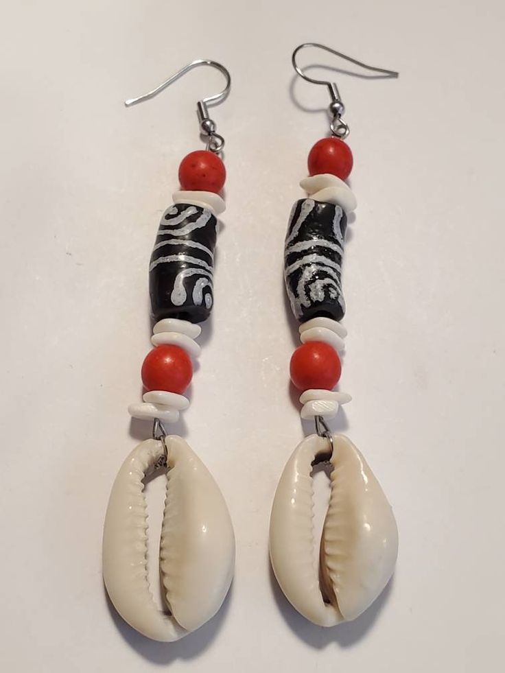 Black White Ghana Krobo Cowrie Shell Dangle Earrings https://etsy.me/35k1qNV Bohemian White Earrings With Black Beads, White Dangle Jewelry With Black Beads, Black Beach Jewelry With Dangling Beads, Beach Jewelry With Black Dangling Beads, Black Dangling Beads Jewelry For Beach, White Drop Earrings With Black Beads, White Bohemian Beaded Earrings With Black Beads, Black Beaded Drop Earrings With Large Beads, Black Large Beaded Drop Earrings