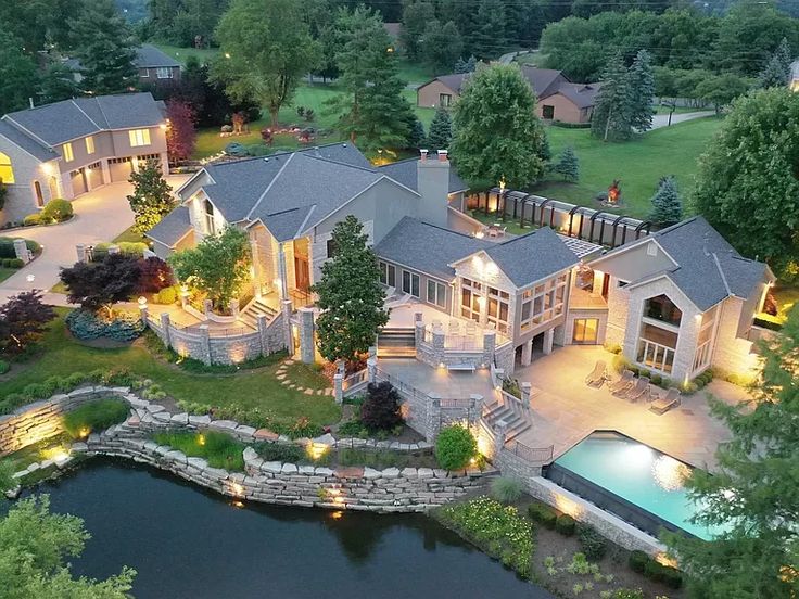 an aerial view of a large home at night