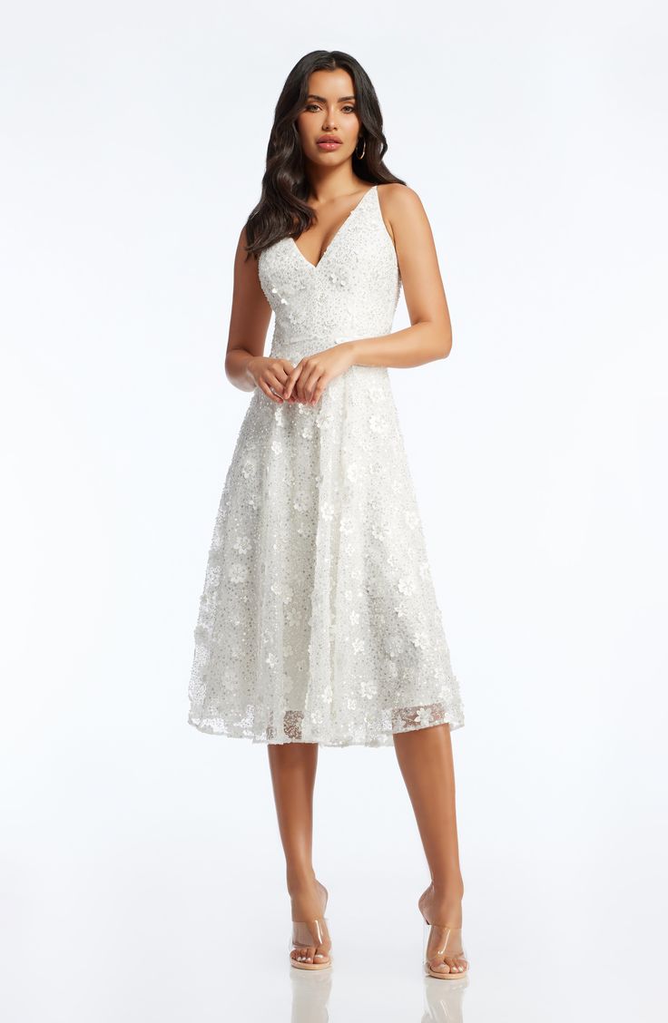 You're sure to turn heads in this gorgeous Ivory dress. Elissa features top-to-bottom white floating floral appliques and sequins. With a sleeveless, form-fitting bodice and a plunging neckline in the front and back, this dress will flatter your figure. The fit and flare silhouette is complemented by a mesh-lined, cocktail-length skirt. Ivory Dress, Ivory Dresses, Floral Applique, Beaded Dress, Plunging Neckline, Gorgeous Dresses, Classy Outfits, Appliques, Fit And Flare