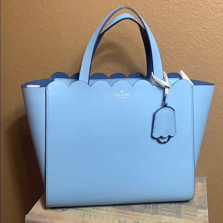 Perfect For Day Or Night 9.6"H X 12"W X 5.7"D Drop Length: 22" Double Faced Smooth Leather Unlined Style # Wkru5744 Satchel With Zip Around Closure Interior Slide Pocket Optional (And Adjustable) Strap Foil Embossed Logo Color: Blue Dawn / Constellation Blue **Brand New With Tags/ In Perfect Condition** Kate Spade Designer Tote Satchel, Designer Kate Spade Tote Satchel, Designer Blue Satchel For Daily Use, Blue Handheld Satchel For Errands, Blue Satchel For Errands, Elegant Blue Shoulder Bag For Errands, Blue Designer Satchel Shoulder Bag With Dust Bag, Elegant Light Blue Satchel For Shopping, Elegant Blue Satchel For Errands