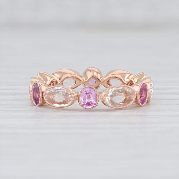 Anniversary Rings With Rose Cut Pink Sapphire, Anniversary Jewelry With Rose Cut Diamonds And Pink Sapphire, Pink Sapphire Round Eternity Band For Anniversary, Elegant Pink Sapphire Eternity Band For Wedding, Rose Gold Stackable Rings With Pink Sapphire For Anniversary, Rose Gold Pink Sapphire Stackable Rings For Anniversary, Anniversary Rose Gold Stackable Rings With Pink Sapphire, Rose Gold Multi-stone Jewelry With Pink Sapphire, Elegant Rose Gold Stackable Rings With Pink Sapphire