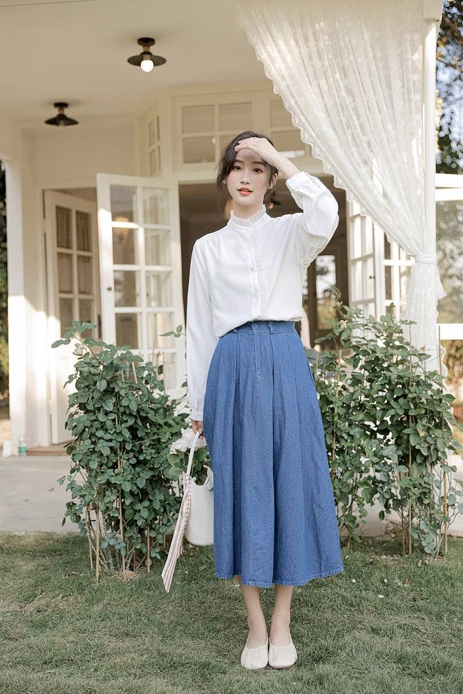 Add a touch of vintage and retro vibe to your outfit. This midi length denim skirt has a button and zip up front, pleats, side pockets, belt loops and elastic back. 24"-34" waist, 30" length High Waist Denim Pleated Skirt For Spring, Spring Pleated Denim Blue Skirt, Retro Denim Blue Skirt For Spring, Casual High Waist Pleated Skirt For Spring, High Waist Retro Pleated Skirt For Spring, Retro High Waist Pleated Skirt For Spring, Retro High-waist Pleated Skirt For Spring, Spring Casual Pleated Skirt With Pockets, Casual Pleated Denim Skirt For Spring