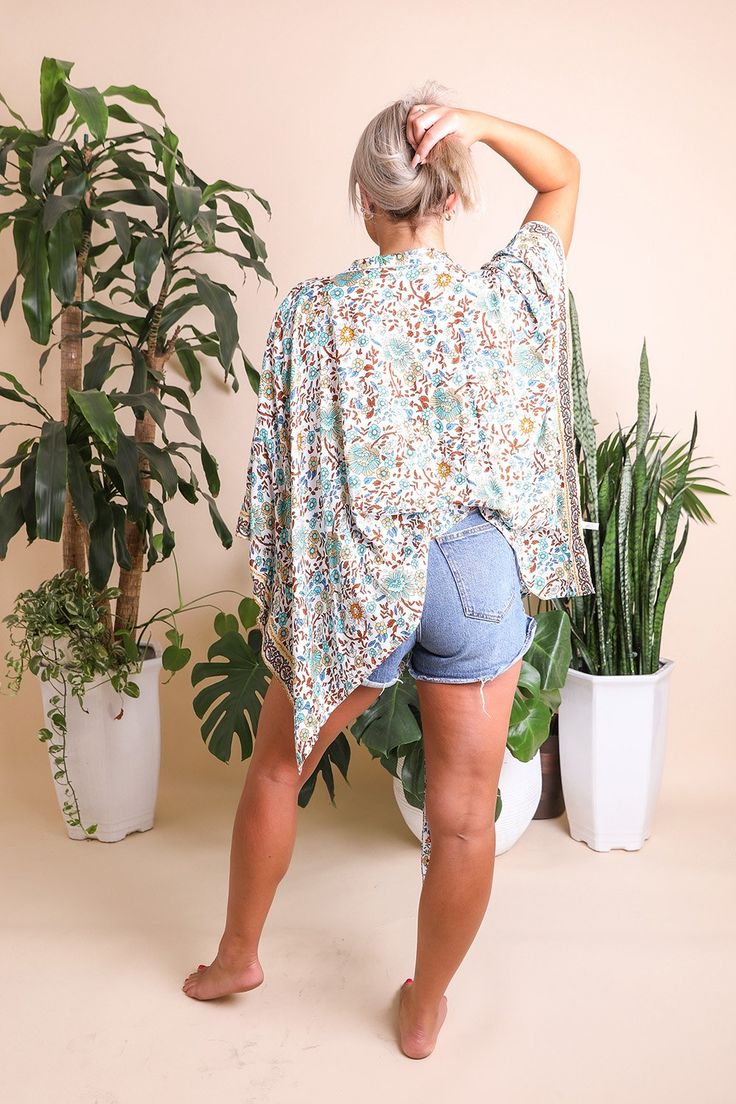 This flattering lightweight versatile floral cuteness is the perfect casual coverup for summer outings. Just pop a bathing suit and a straw sunhat, and you're ready to go! #lovemyleto 100% Viscose Imported Printed Summer Cover-up For Day Out, Breezy Spring Cover-up With Relaxed Fit, Spring Tropical Swimwear With Relaxed Fit, Breezy Relaxed Fit Spring Cover-up, Tropical Style Relaxed Fit Swimwear For Spring, Relaxed Fit Beach Season Cover-up, Tropical Relax-fit Swimwear For Spring, Beachy Upf 50+ Tops For Spring, One Size Summer Beach Cover-up