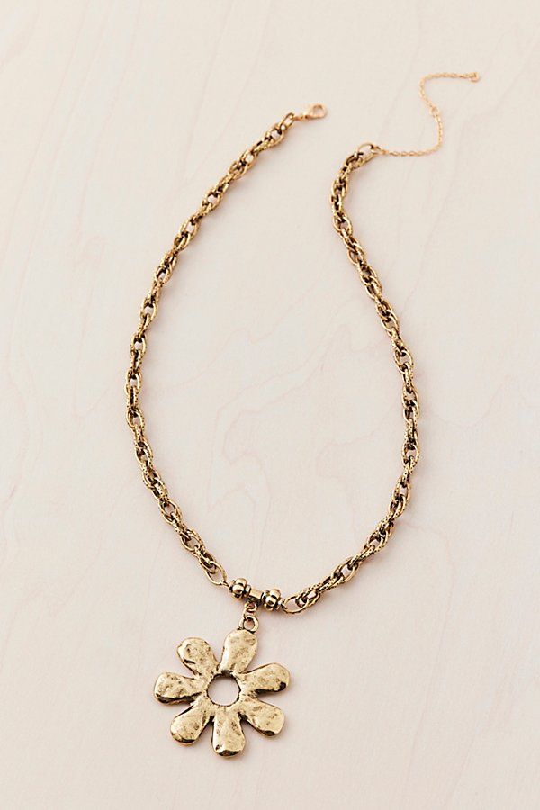 Chunky chain necklace trimmed with an oversized flower pendant in hammered metal. Features Faye flower chain pendant necklace Antiqued chain necklace Flower pendant in hammered metal Clasp closure Content + Care Mixed metal Avoid contact with water Imported Size Dimensions: 16" l | Faye Flower Chain Pendant Necklace in Gold, Women's at Urban Outfitters Chunky Chain Necklace, Flower Chain, Men's Shoes Accessories, Chunky Chain Necklaces, Necklace Flower, Hammered Metal, Women Men Shoes, Chain Pendant, Mixed Metals